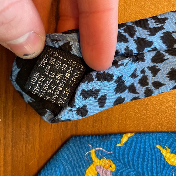 Blue Gianni Versace tie with Gold Cupid pattern. - Picture 2 of 5